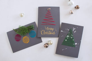 Bestickte Weihnachtskarten mit Tannenbaum aus rotem und grünem Stickgarn
