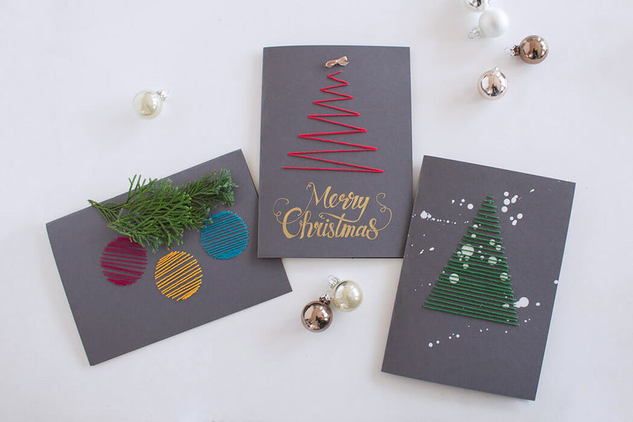 Bestickte Weihnachtskarten mit Tannenbaum aus rotem und grünem Stickgarn